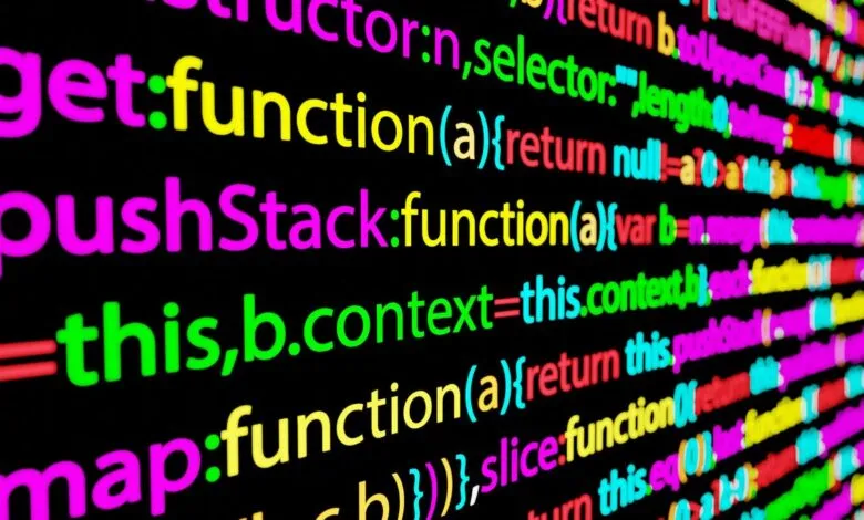 Close-up of colorful code on a black background, showing programming functions.