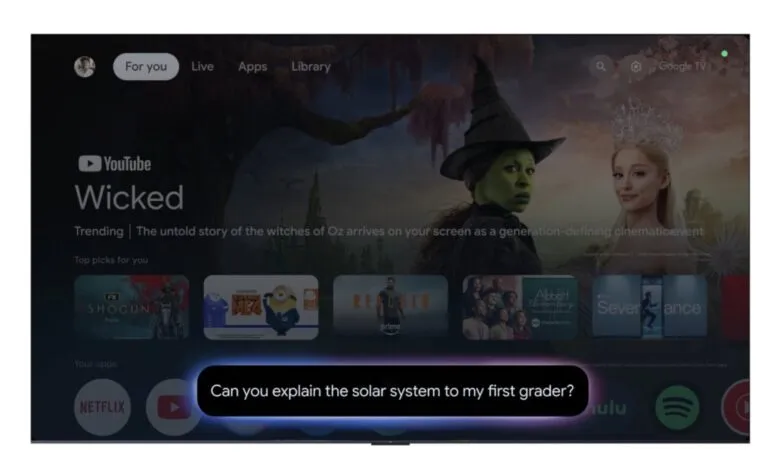 Google TV interface displaying the musical Wicked and a voice command prompt.