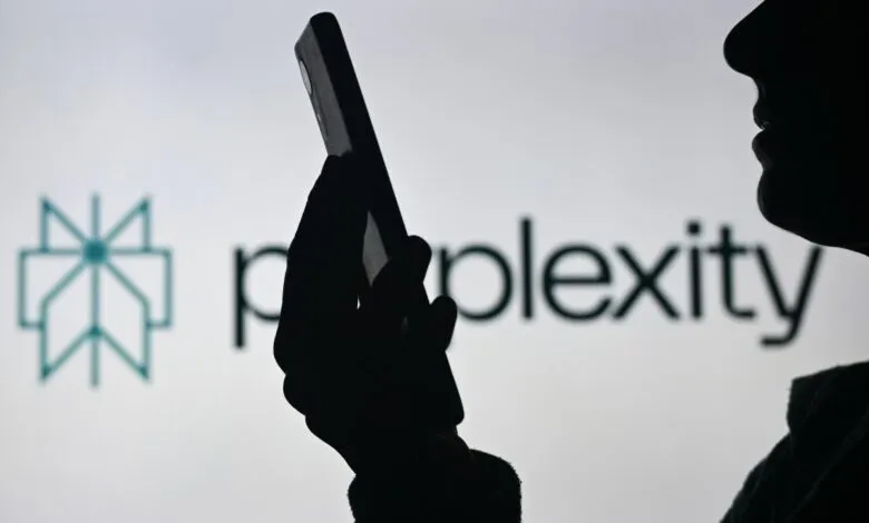Silhouette of person using phone with 'perplexity' logo in background.