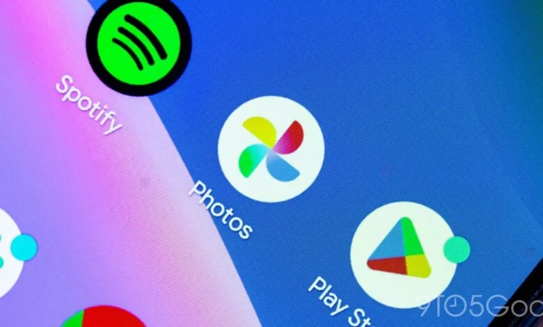 Close-up of app icons on a smartphone screen: Spotify, Google Photos, Play Store.