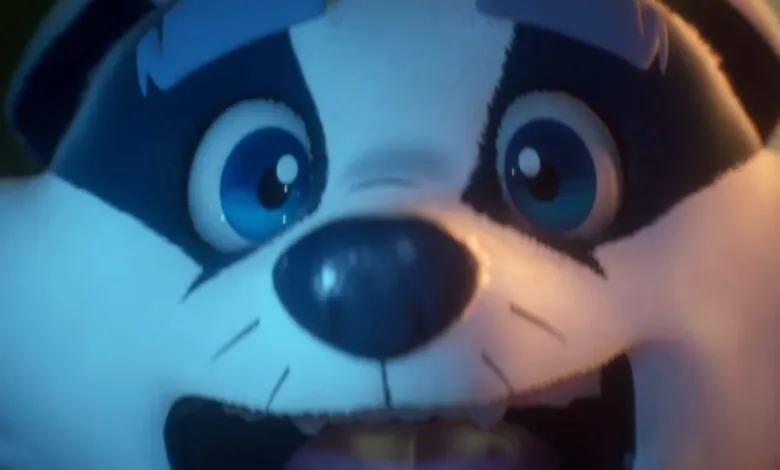 Close-up of a cartoon raccoon face with wide eyes and open mouth.