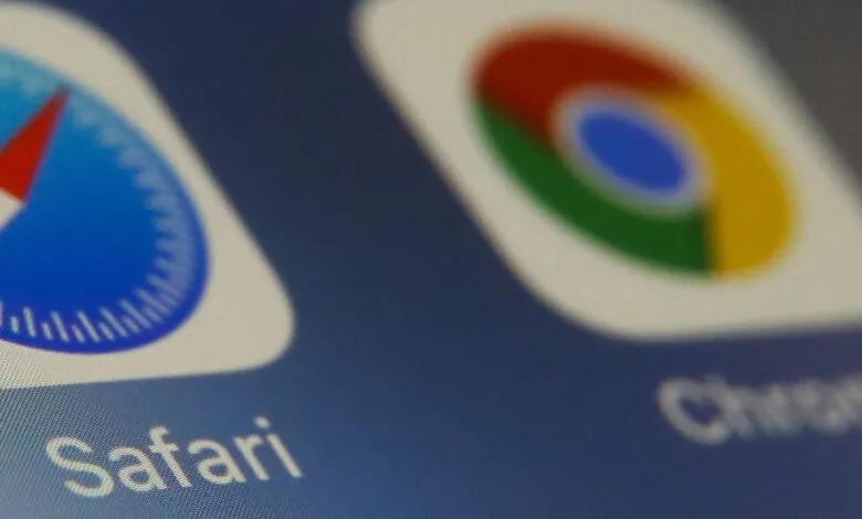 Close-up of Safari and Chrome app icons on a blue screen.