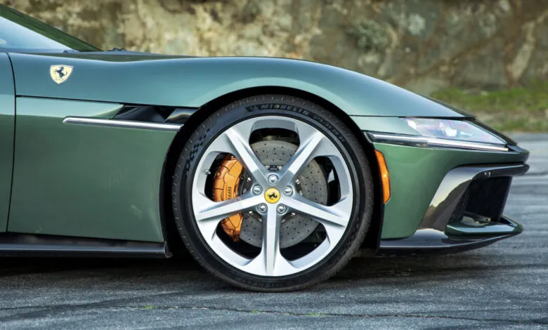 Close-up of a green Ferrari 12Cilindri Spider's front end, focusing on the wheel.