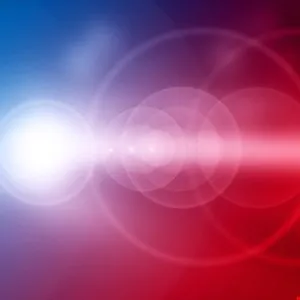 Abstract background with blue and red gradients and lens flare effects.