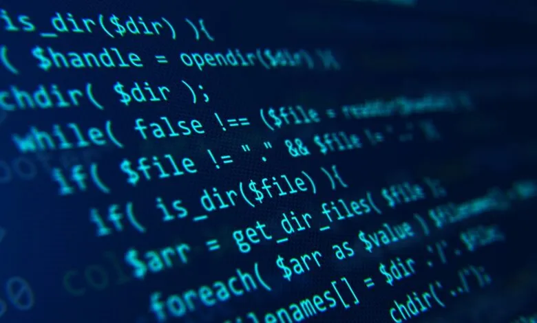 Close-up of computer code on a dark blue screen.