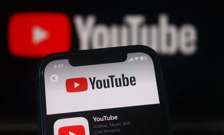 Close-up of a smartphone displaying the YouTube app interface.