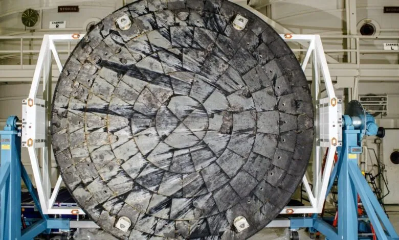 Heat shield with tiles mounted on a rotating test stand.