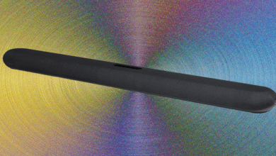 Black soundbar on a colorful, textured background.