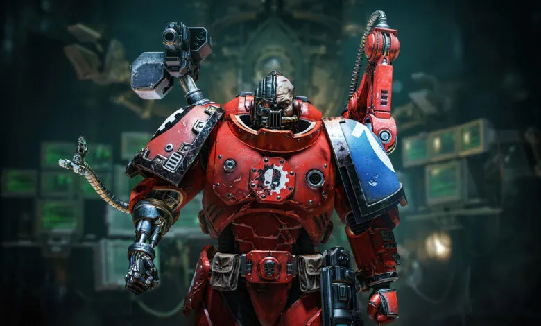 Warhammer 40k Techmarine in red power armor stands ready.