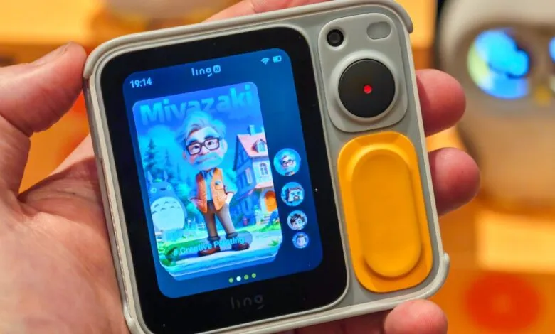 Hand holding Ling device showing Miyazaki cartoon avatar.