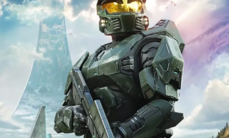 Master Chief stands ready in Halo Infinite, ring world in background.