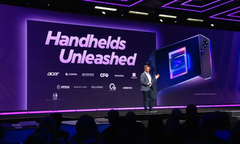 Presenter on stage at 'Handhelds Unleashed' event with device graphic.