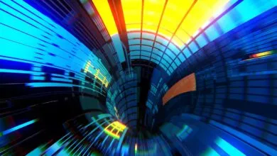 Abstract tunnel with blue, yellow, and orange geometric shapes.