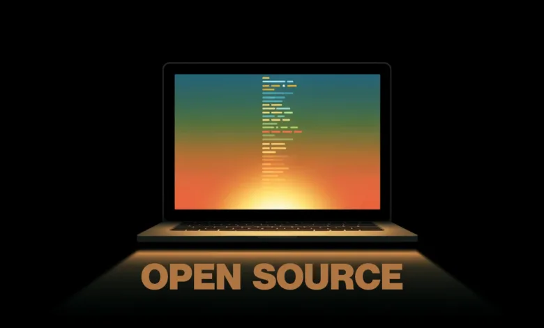 Laptop displaying code with 'Open Source' text below on black background.