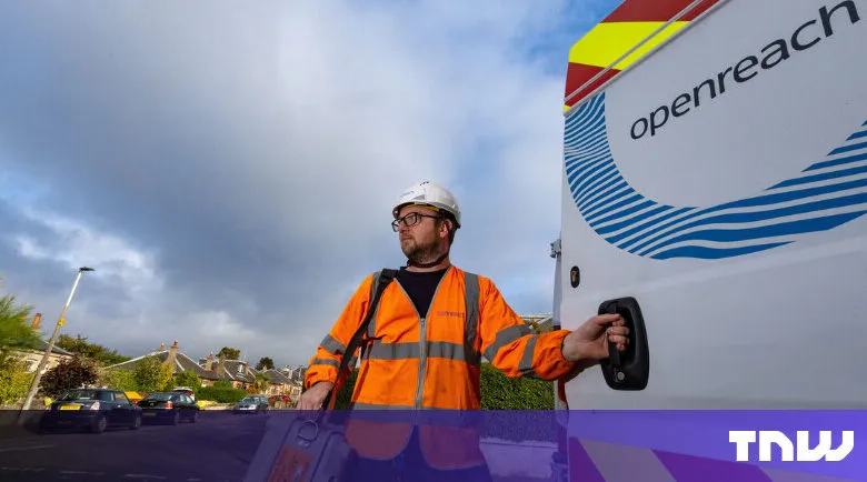 Openreach engineer in safety gear by company van on a street.