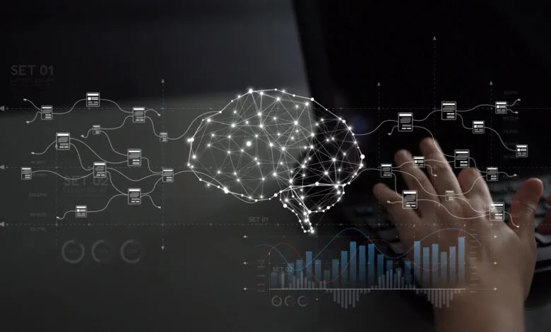 AI brain graphic overlayed on hands typing on a laptop keyboard.