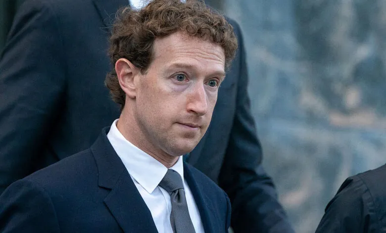 Mark Zuckerberg in suit, looking slightly downcast.