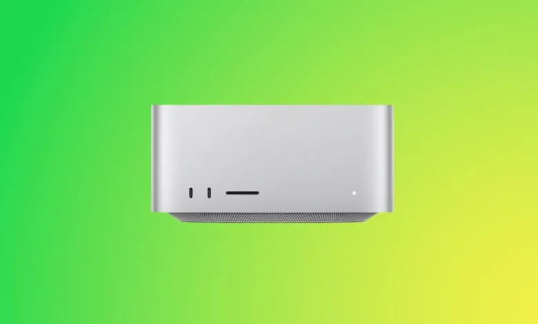 Silver Mac Studio desktop computer on a vibrant green and yellow gradient background.