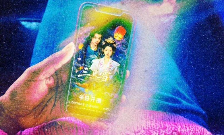 Hand holding phone displaying poster for Chinese drama 'The Tower of Endless Rivers'.