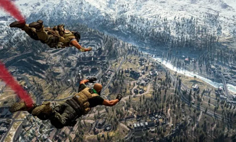 Two soldiers parachute over a snowy mountain landscape with red smoke trails.