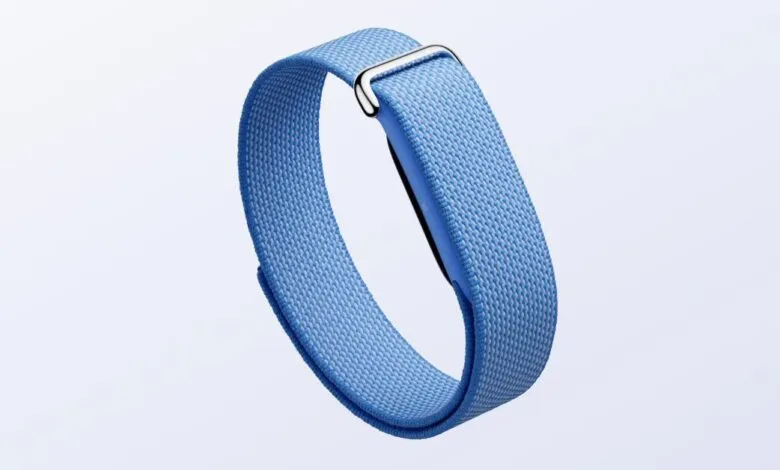 Light blue Fitbit band with silver buckle on a white background.