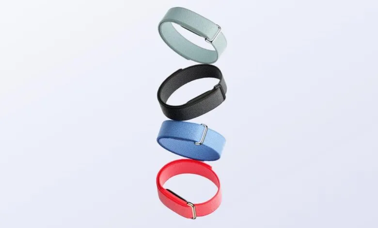 Four colorful Fitbit Inspire 3 bands stacked on a white background.