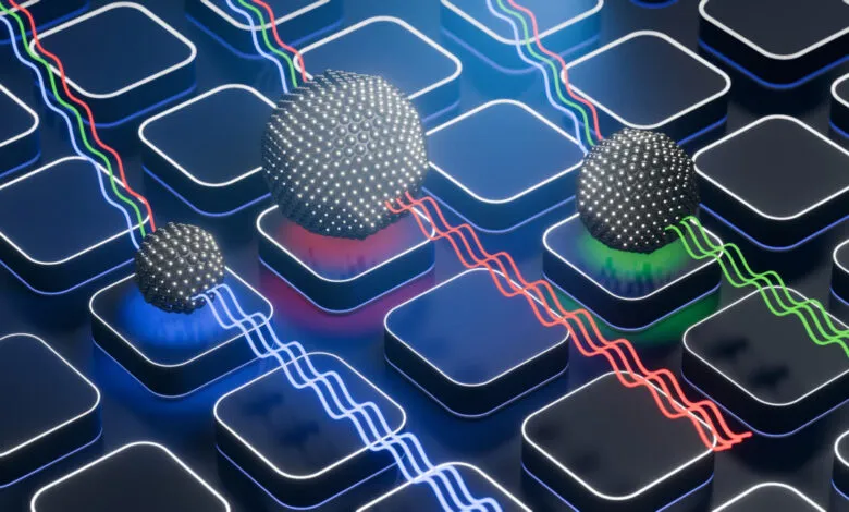 3D rendering shows quantum dots of varying sizes emitting different colored light.