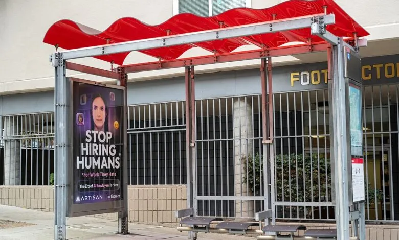 Bus stop ad promotes Artisan AI, urging to 'Stop Hiring Humans'.