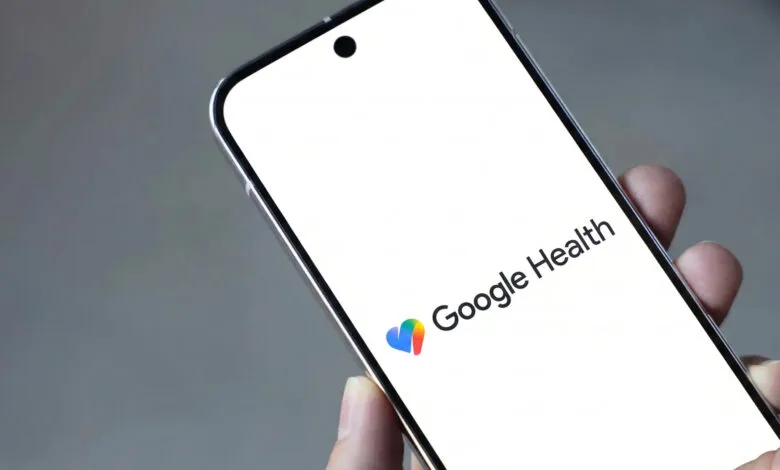 Close-up of a phone displaying the Google Health logo on a white screen.