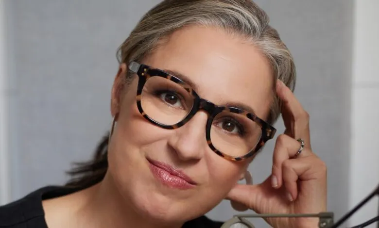 Close-up portrait of Manoush Zomorodi wearing glasses and smiling.
