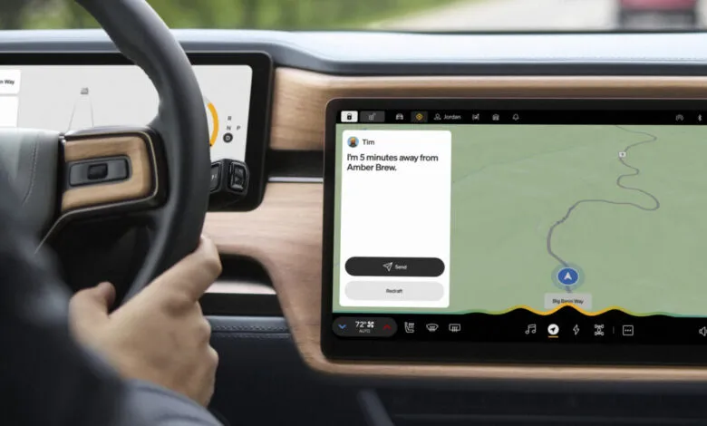 Rivian dashboard showing navigation and messaging features, driver's hand on the wheel.