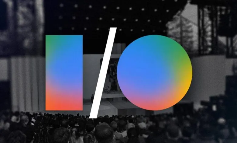 Google I/O logo over a blurred crowd at a conference, black and white background.