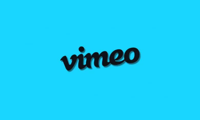 Vimeo logo in black with shadow on a bright blue background.