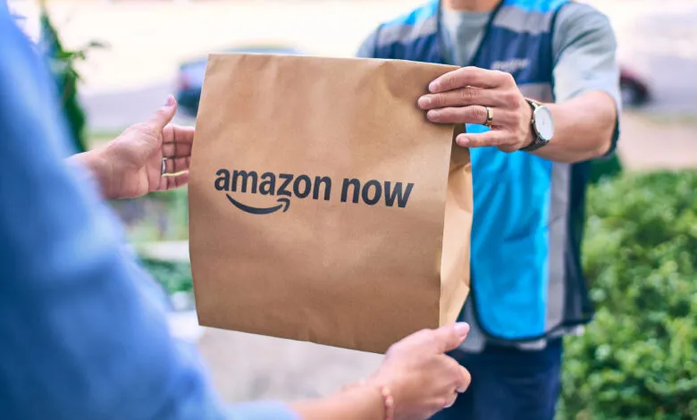 Amazon Now delivery being handed to customer at their door.