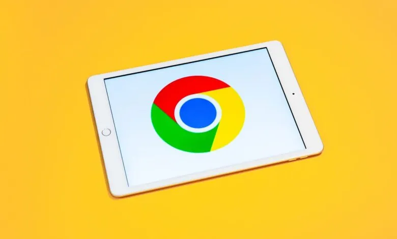 Tablet displaying the Google Chrome logo on a bright yellow background.