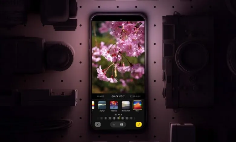 Smartphone displaying photo editing app with cherry blossom image.