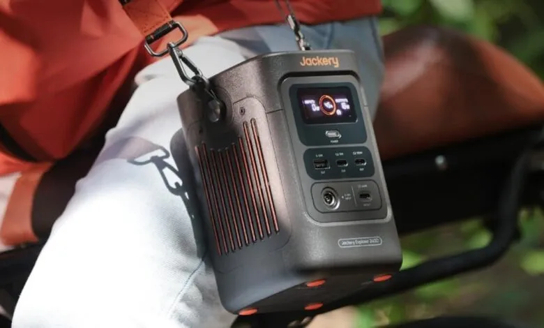 Jackery Explorer 2400 portable power station with shoulder strap.