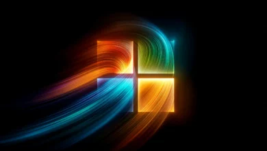 Colorful Windows logo with flowing light trails on black background.