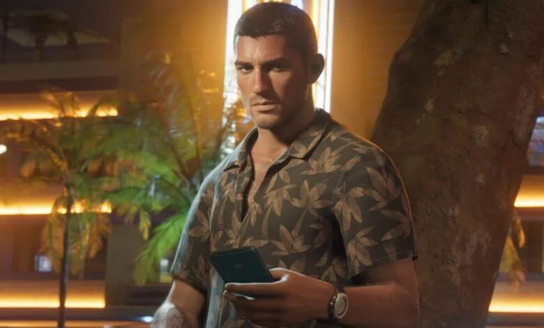 Man in tropical shirt checks phone at night, leaning against tree.