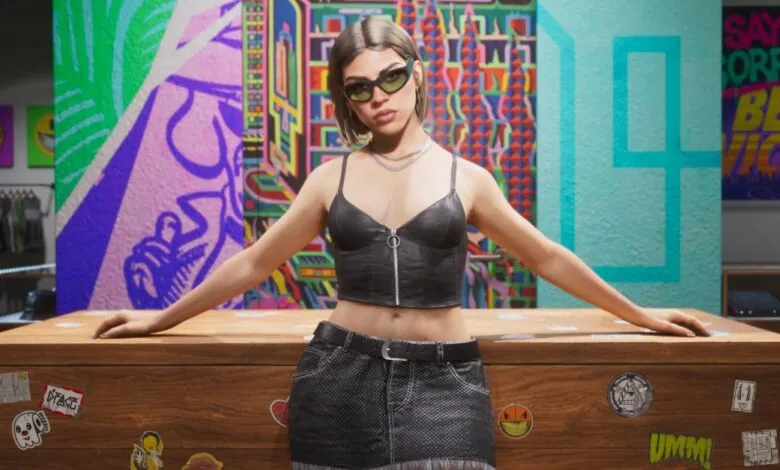 A stylish young woman in a black crop top and sunglasses leans over a wooden counter.