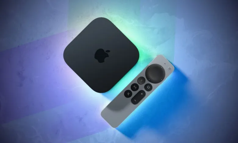 Black Apple TV box and silver Siri Remote resting on a textured blue and purple surface.