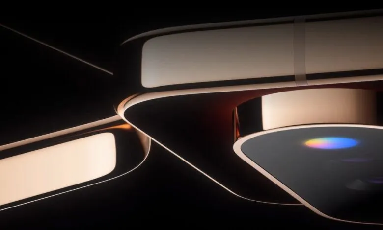 Close-up abstract view of futuristic device with glowing metallic curves and colorful lens flare
