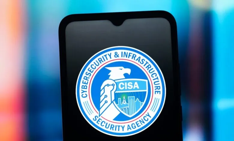 Smartphone displaying the blue and white logo of the Cybersecurity and Infrastructure Security Agency