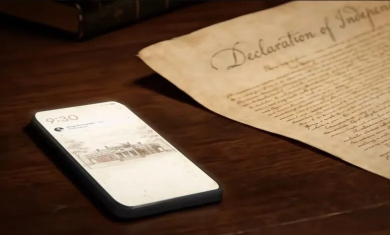 Smartphone displaying a notification from Benjamin Franklin next to the Declaration of Independence