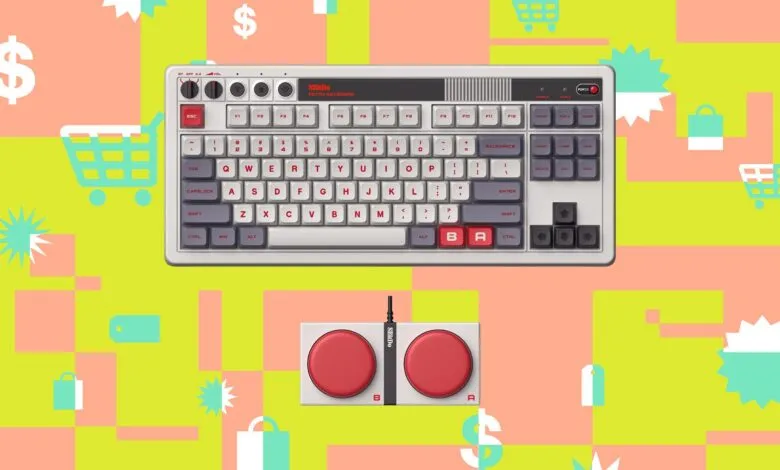 Top-down view of an 8BitDo mechanical retro keyboard and matching dual super buttons against a vibrant background.