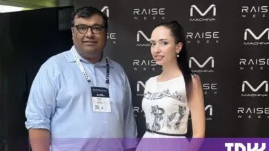 Abhinav Gupta from Skild AI and Anna Tutova pose together at a tech event.