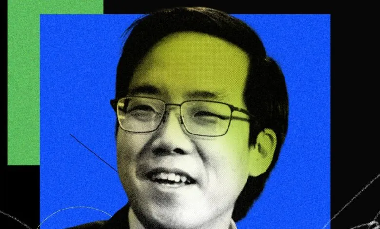 Portrait of Andy Yen, CEO of Proton, set against a vibrant blue and green background.