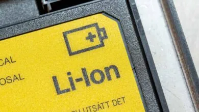 Close-up of a bright yellow and black Li-Ion battery warning label with a battery icon.