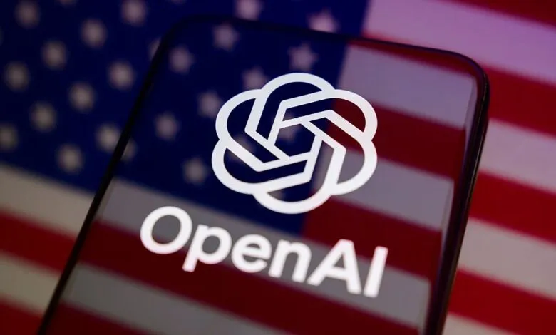 Smartphone displaying the OpenAI logo against the backdrop of an American flag.