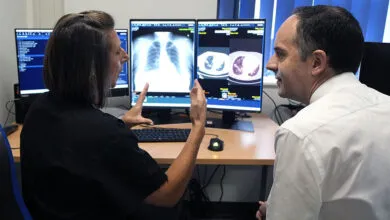 Health Secretary James Murray speaks with consultant radiologist Anna Sharman at Wythenshawe Hospital.